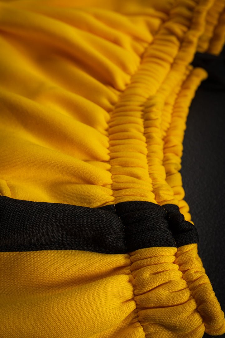 Short Training Division Amarillo/Negro - Heredia Clothing